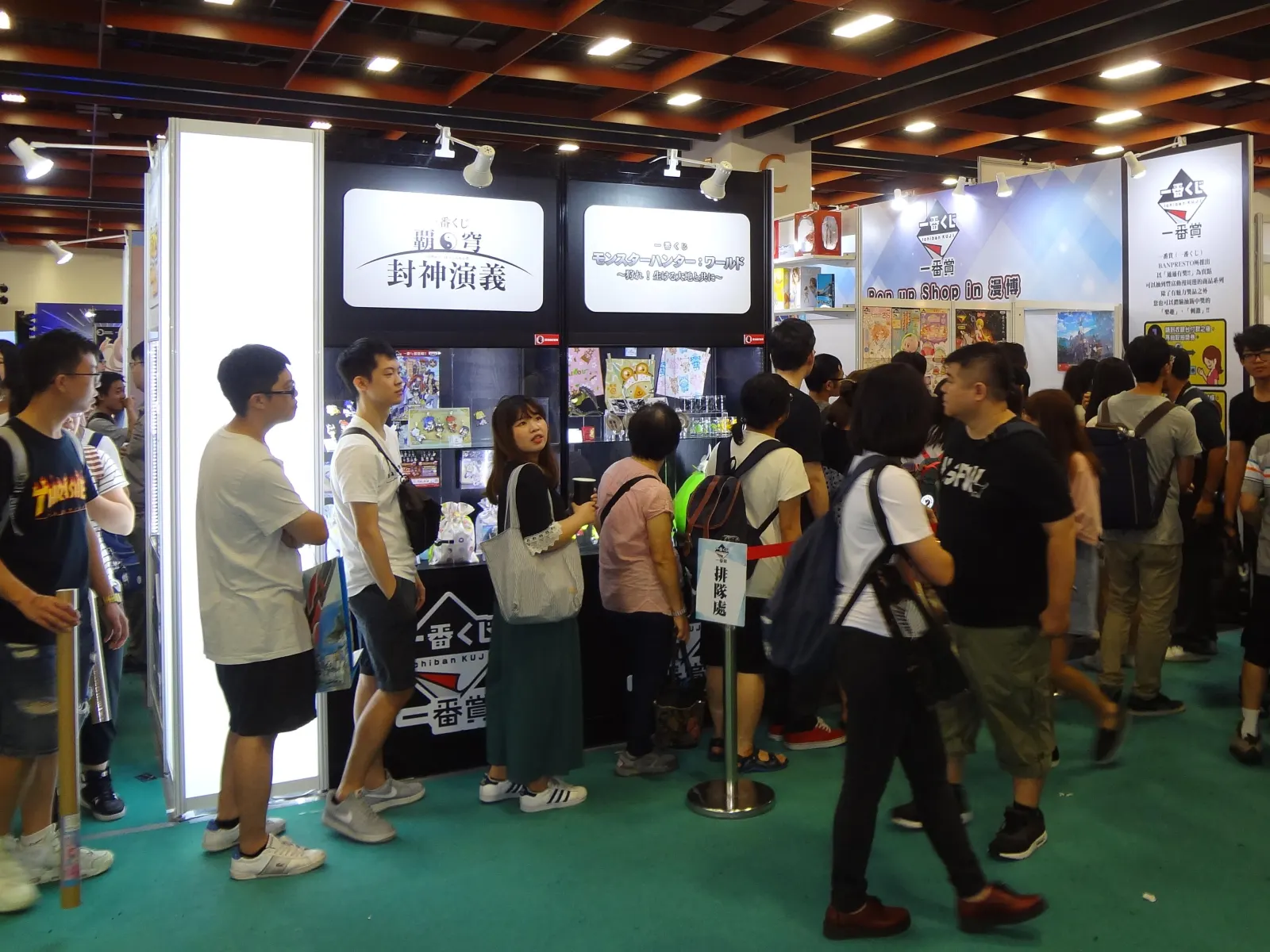 A crowd lining up at an Ichiban Kuji pop-up booth run by Bandai Namco Taiwan at a Taipei comics exhibition.